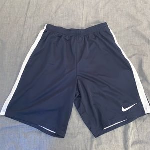 NIKE. Navy blue & white basketball shorts.